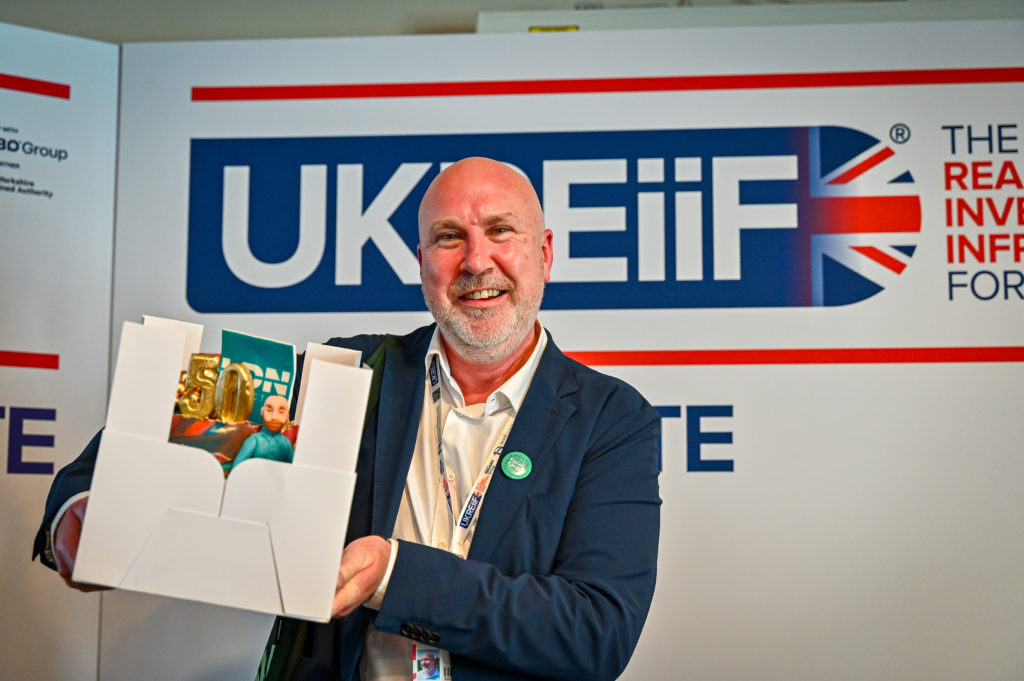 Max Farrell, CEO at LDN Collective recieves cake at UKREiiF 2024